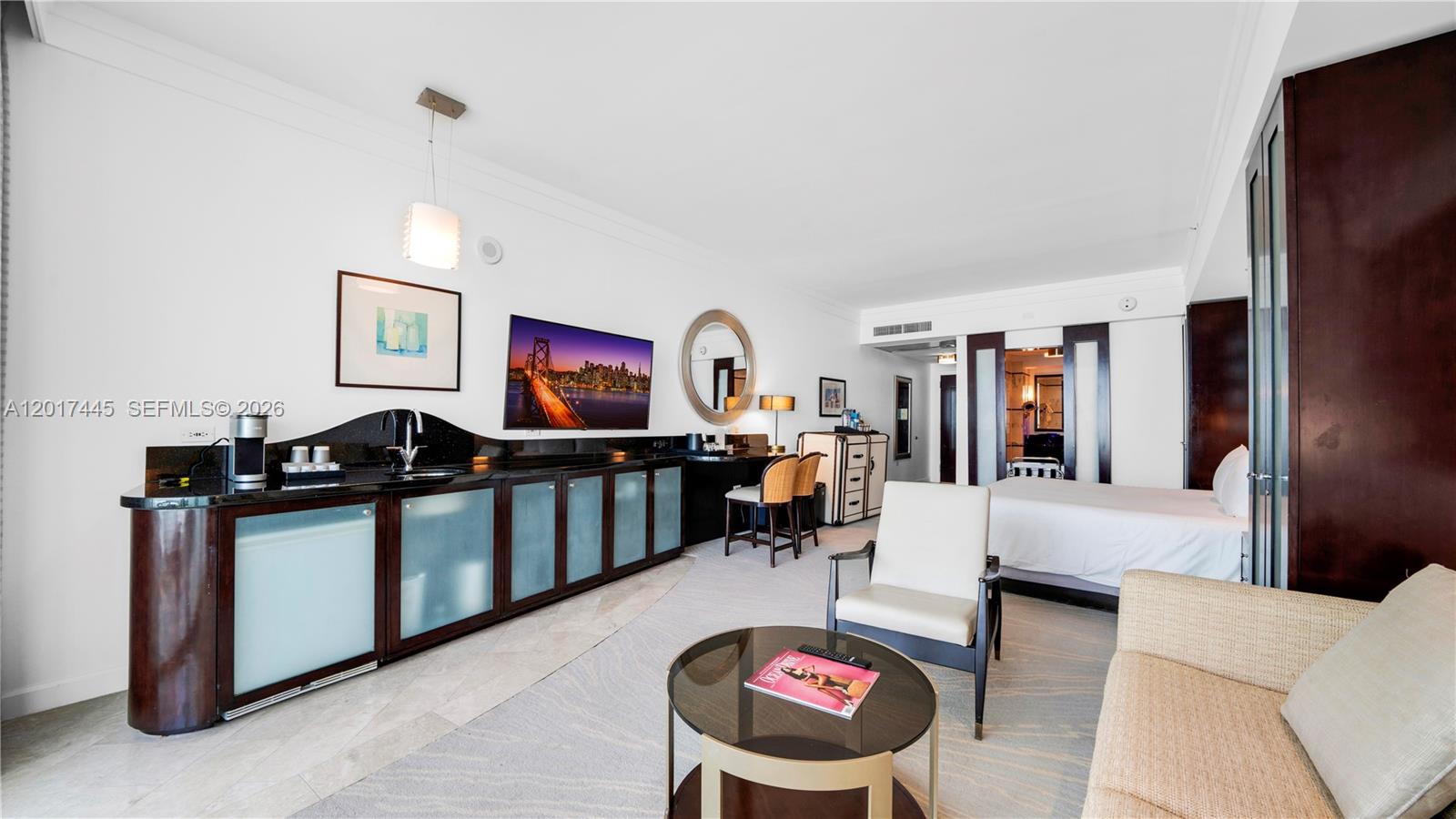 A hotel room features a wet bar, a television, a seating area, and a bed — 4391 Collins Ave # 1903, Miami Beach FL 33140, MIAMI BEACH, FL