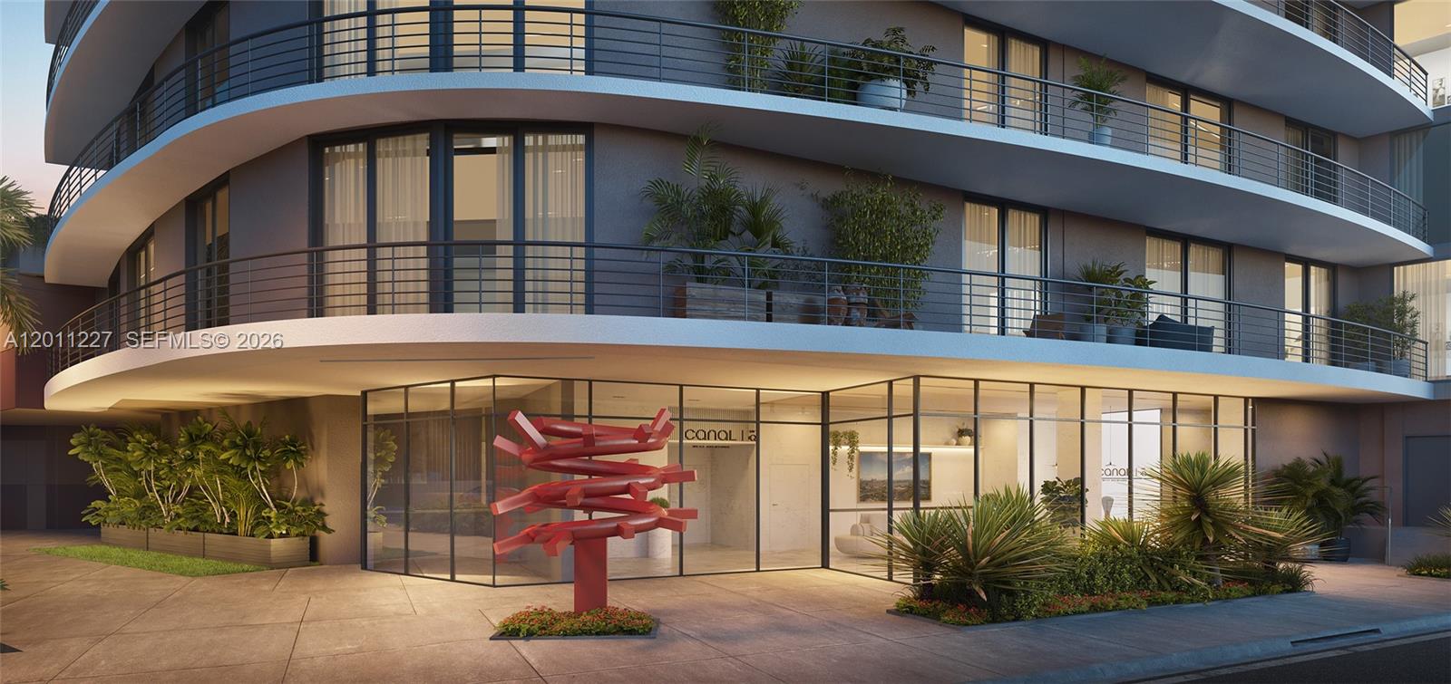 This architectural rendering shows the exterior entrance of a modern building with a red sculpture — 18550 NE 23rd Ct # 304, Miami FL 33180, MIAMI, FL
