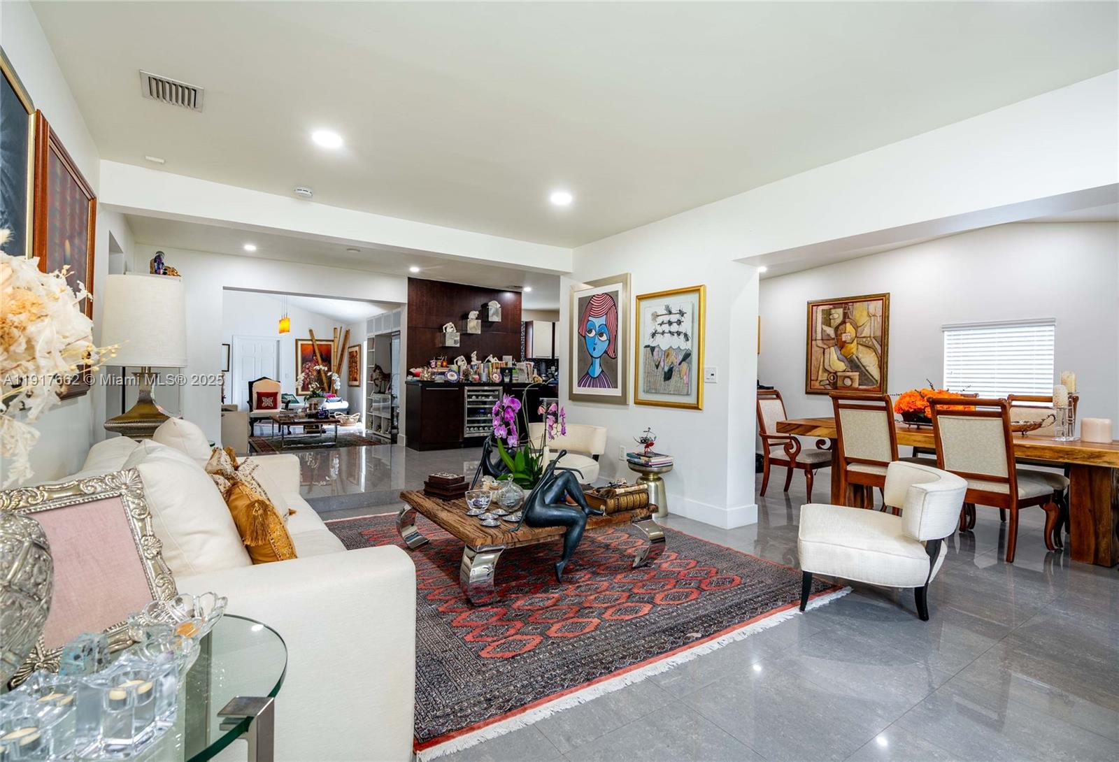 A concrete walkway leads to a house entrance framed by a large cluster of bamboo — 1360 SW 16th St, Miami FL 33145, MIAMI, FL