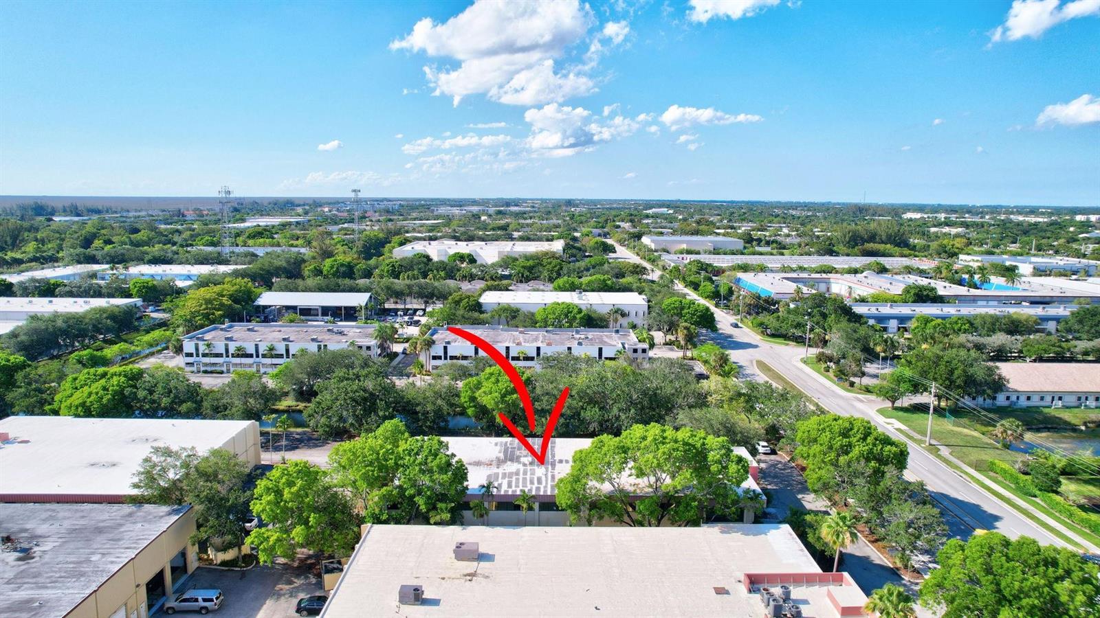 An aerial view shows a commercial building with a red arrow pointing to its roof — 4505 NW 103rd Avenue, Sunrise FL 33351, SUNRISE, FL