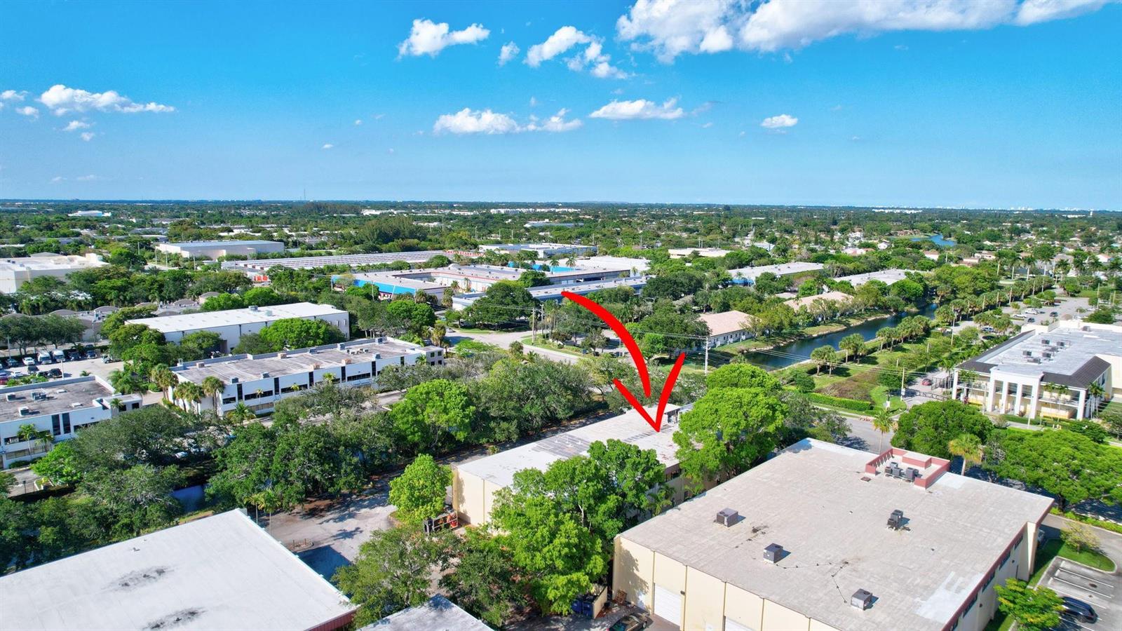 An aerial view shows a commercial building complex surrounded by trees and parking lots — 4505 NW 103rd Avenue, Sunrise FL 33351, SUNRISE, FL
