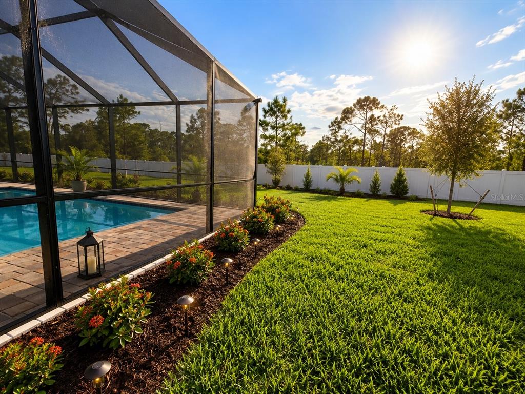 A swimming pool and spa enclosed by a screen cage with a paver deck — 8212 SAINT KITTS CIRCLE, ENGLEWOOD, FL
