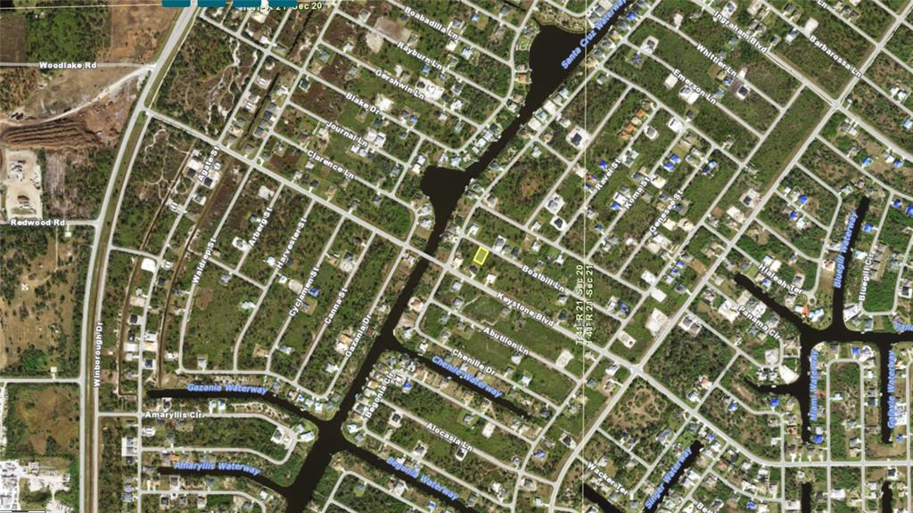 This is an aerial map showing a residential neighborhood with a highlighted property lot — 13465 BOATBILL LANE, PORT CHARLOTTE, FL
