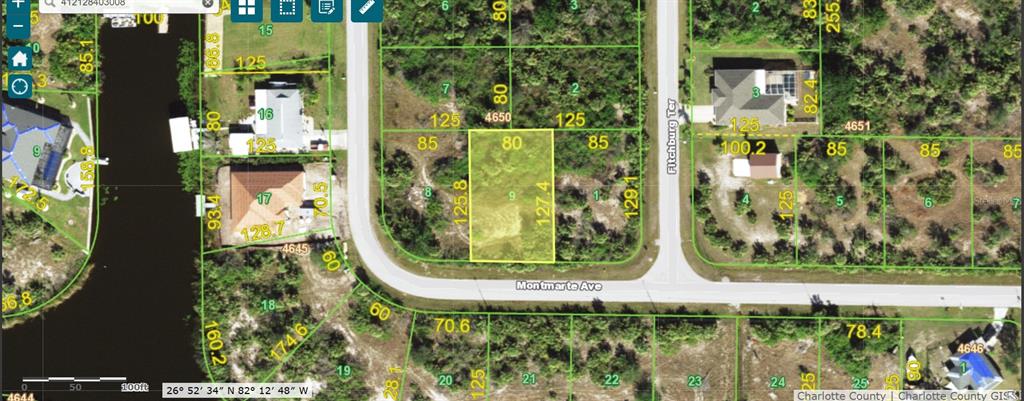 This is a satellite map view of a rectangular vacant lot highlighted in yellow — 14298 MONTMARTE AVENUE, PORT CHARLOTTE, FL