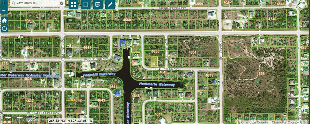 This is a satellite map view showing residential land parcels and waterways in a neighborhood — 14298 MONTMARTE AVENUE, PORT CHARLOTTE, FL