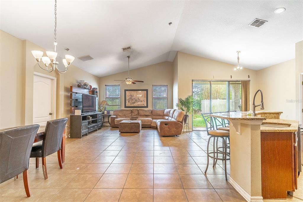 An aerial view shows a community swimming pool with lounge chairs and a covered pavilion — 9907 ARMANDO CIRCLE, ORLANDO, FL
