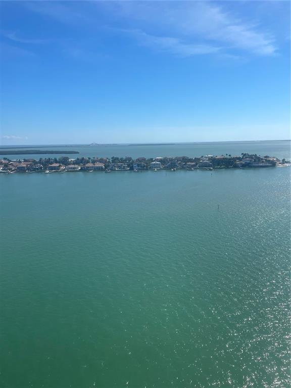 An aerial view shows a residential island community surrounded by a large body of water — 5200 BRITTANY DRIVE S UNIT 1804, ST PETERSBURG, FL