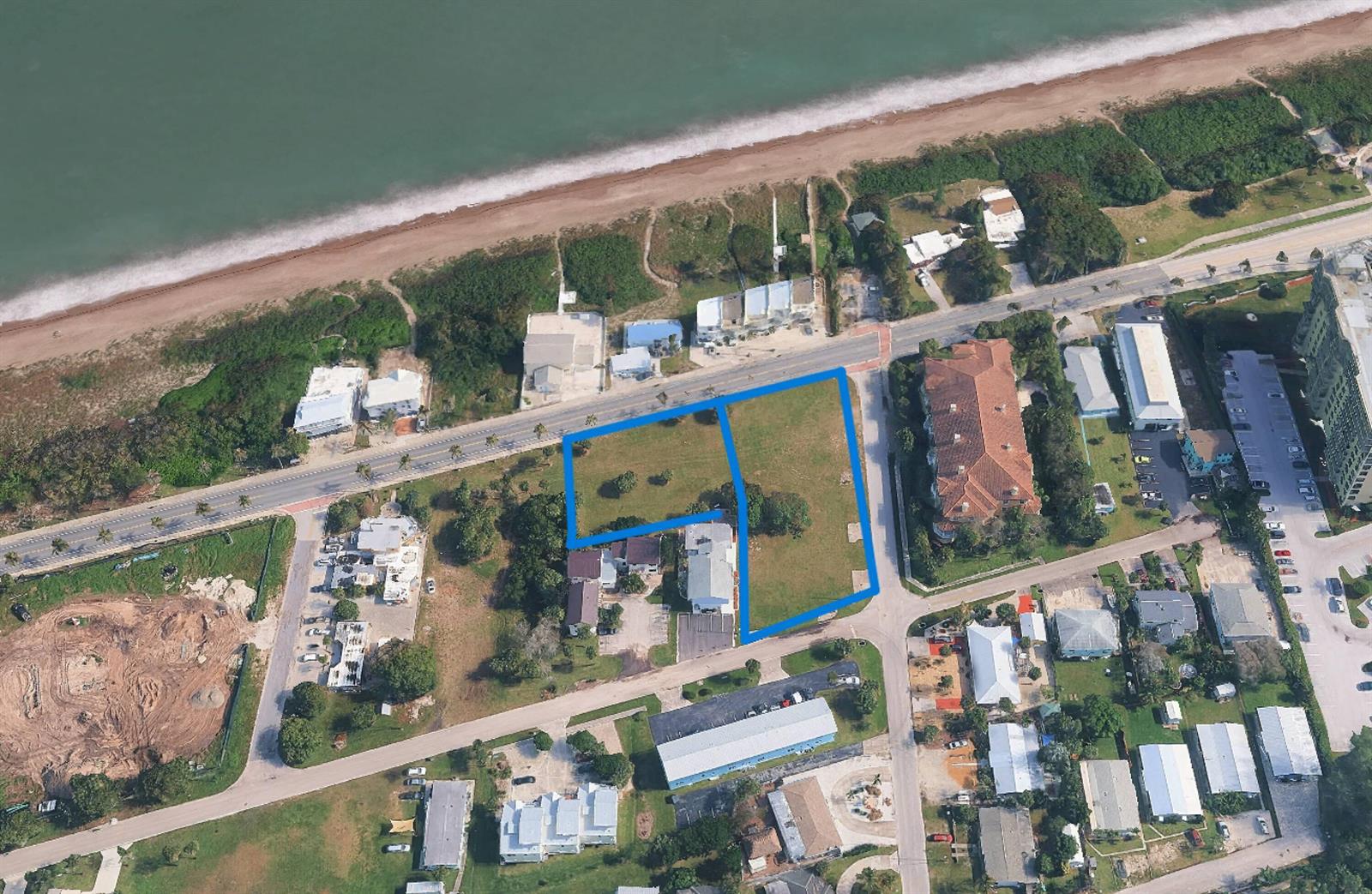 An aerial view shows two adjacent vacant lots outlined in blue near a beach — 609 & 615 S Ocean Drive, Fort Pierce FL 34949, FORT PIERCE, FL