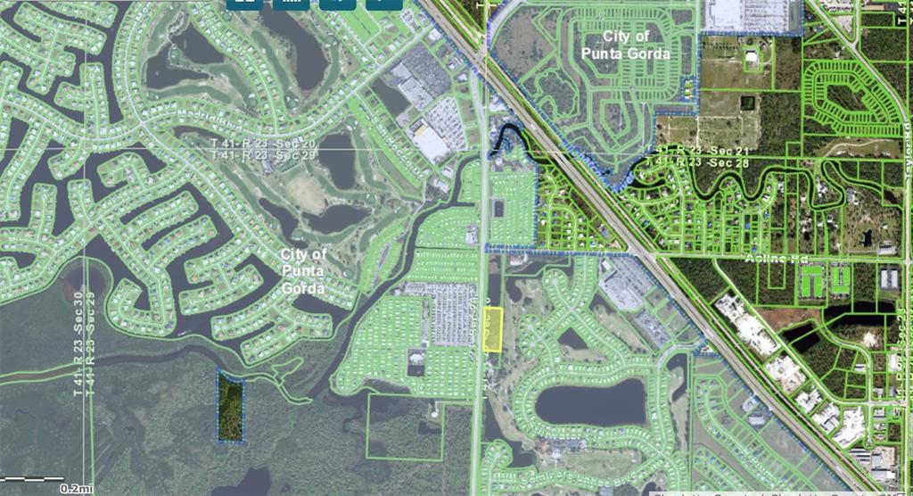 This is a map showing two highlighted land parcels in a residential area of Florida — 10200 BURNT STORE ROAD, PUNTA GORDA, FL