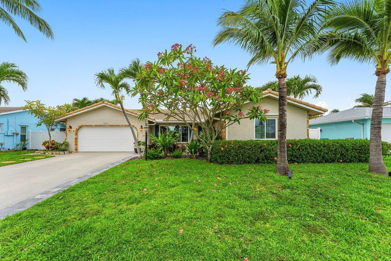 A single-story house with a white garage, palm trees, and a green lawn — 2527 SW 12th Street, Boynton Beach FL 33426, BOYNTON BEACH, FL