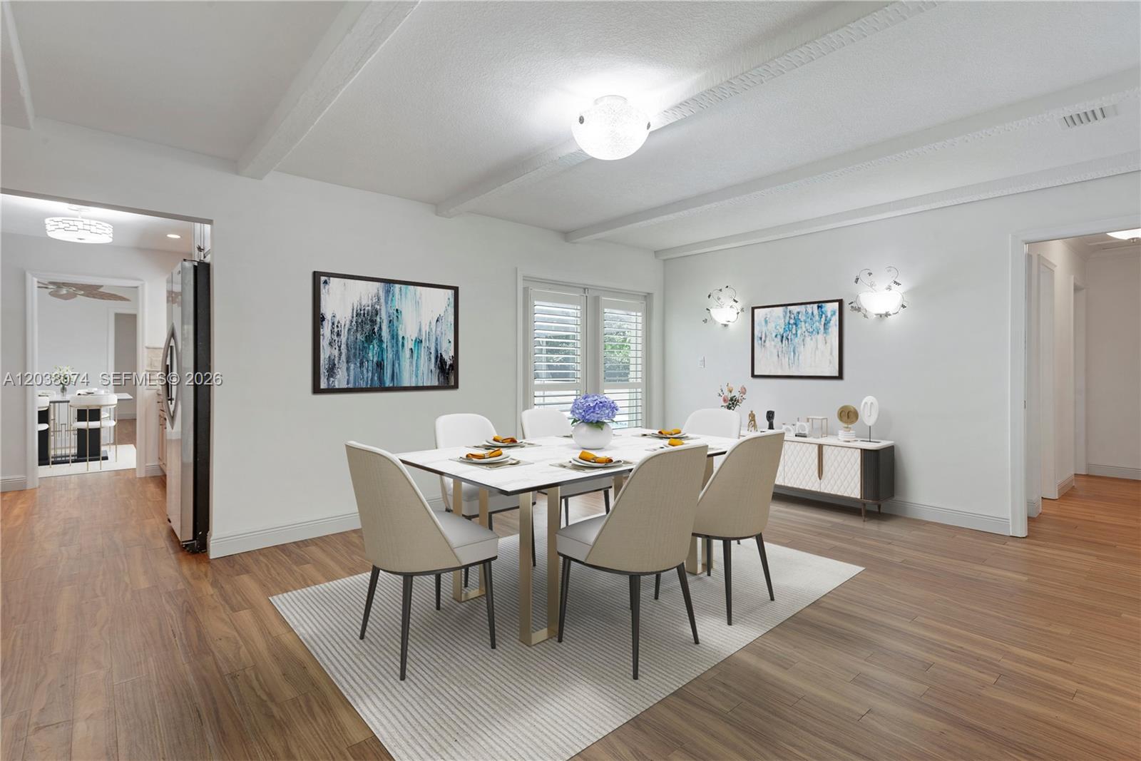 A dining room features a marble-topped table, six chairs, and wood-look flooring — 7715 SW 122nd St, Pinecrest FL 33156, PINECREST, FL