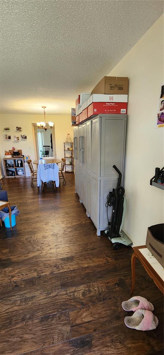A dining area is visible beyond a large grey storage cabinet in a living space — 191 E Preston  E # 191, Boca Raton FL 33434, BOCA RATON, FL