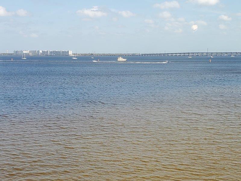 A view of a large body of water with boats and a distant bridge — 1600 W MARION AVENUE UNIT 232, PUNTA GORDA, FL