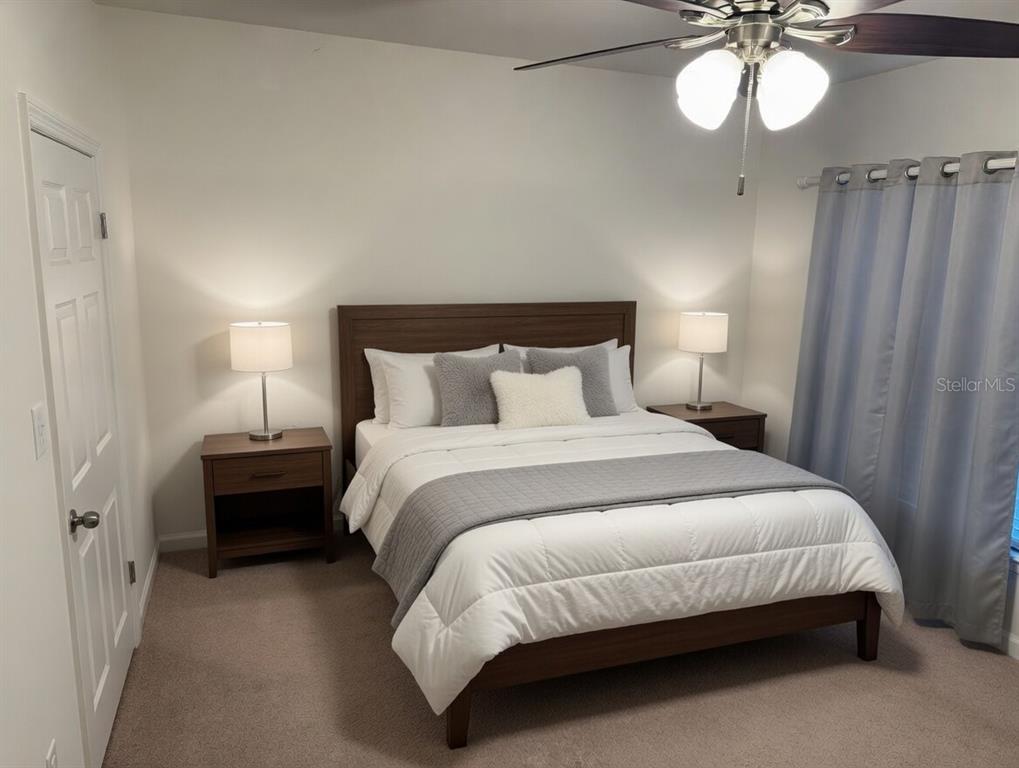 A bedroom features a wooden bed frame, two nightstands with lamps, and gray curtains — 1708 NW 29TH TERRACE, CAPE CORAL, FL