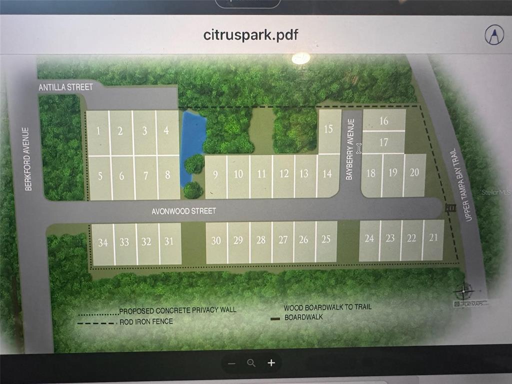 This is a site plan map showing numbered residential lots, streets, and surrounding wooded areas — 110 SKYTRAIL, TAMPA, FL