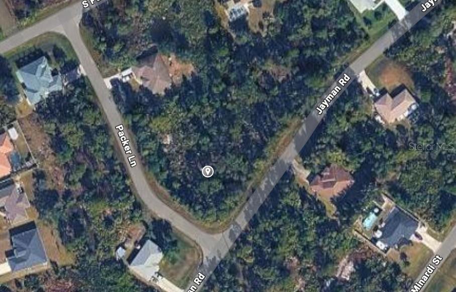 This is an aerial map view of a vacant, wooded corner lot between two roads — JAYMAN ROAD, NORTH PORT, FL