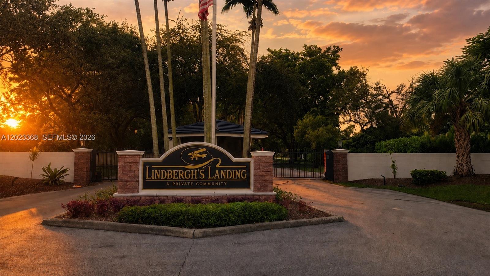 The entrance sign for Lindbergh's Landing stands before a gated community at sunset — 18111 SW 158th St, Miami FL 33187, MIAMI, FL