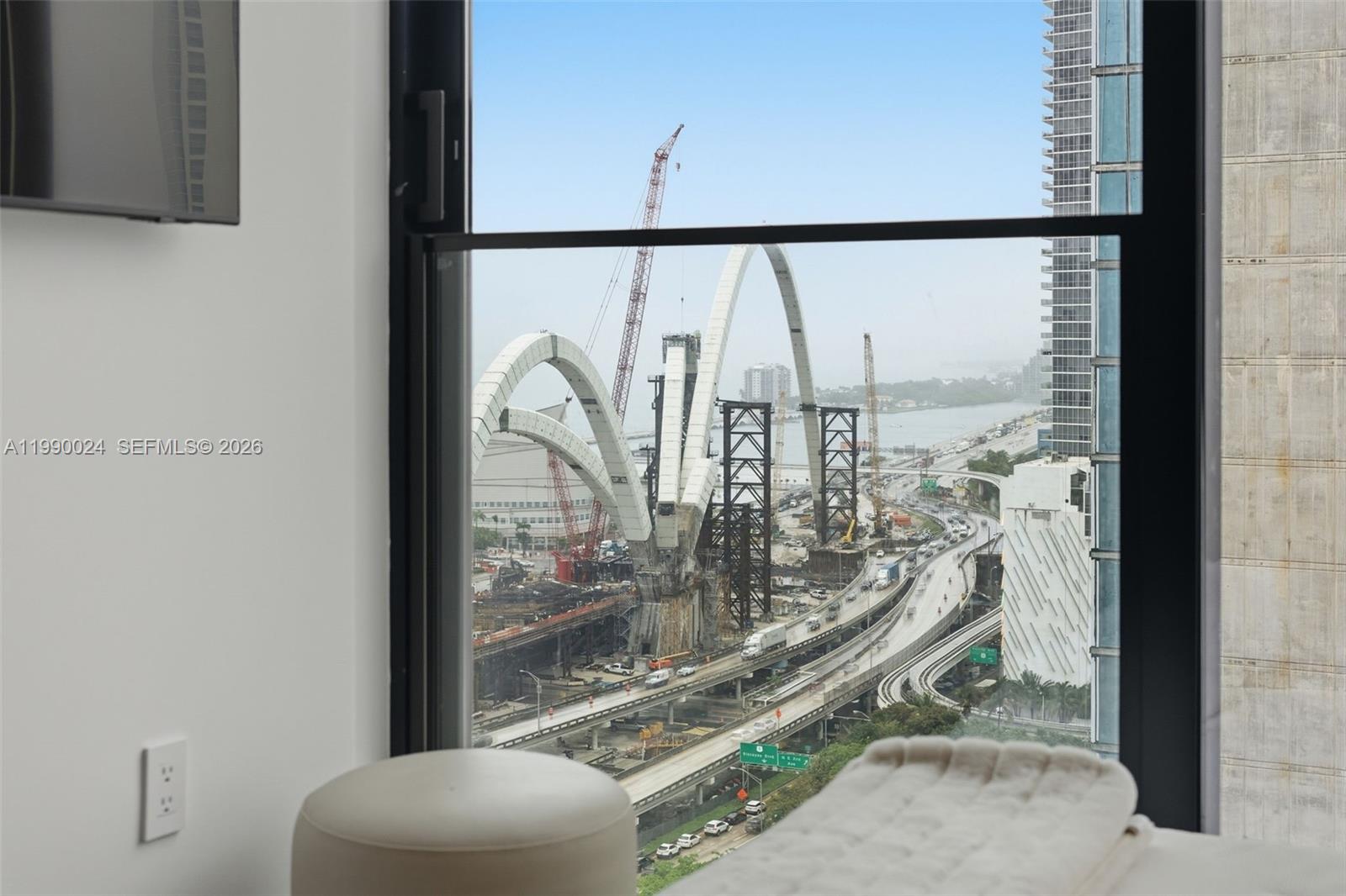 A view from a room window shows the construction of the Signature Bridge in Miami — 20 NE 11th St # 2306A, Miami FL 33132, MIAMI, FL