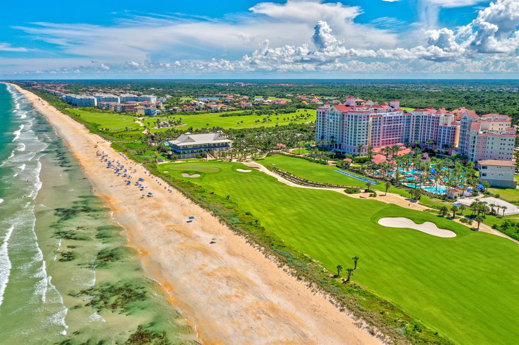 An aerial view of a large beachfront resort hotel next to a golf course — 200 OCEAN CREST DRIVE UNIT 642, PALM COAST, FL