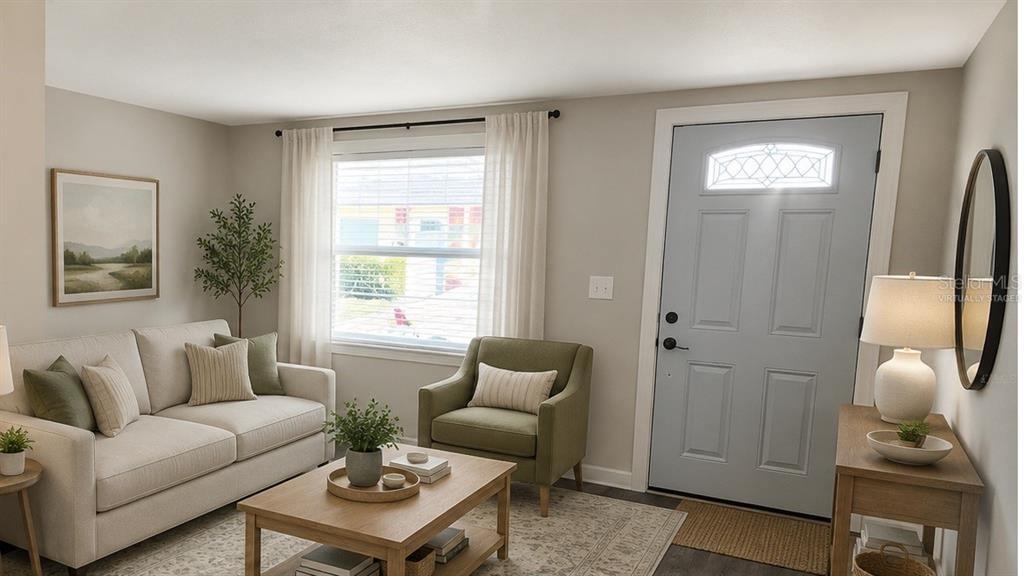 A living room features a light-colored sofa, a green armchair, a coffee table, and a door — 5000 BITNER STREET, NEW PORT RICHEY, FL