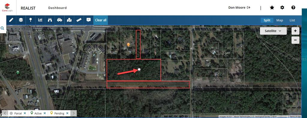 This is a satellite map view showing a highlighted parcel of land with a red border — 000 NW 35TH STREET, OCALA, FL