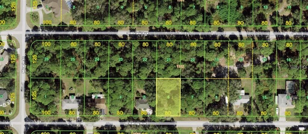 This is an aerial map showing a highlighted vacant residential lot among surrounding wooded properties — 17188 KELLOG AVENUE, PORT CHARLOTTE, FL