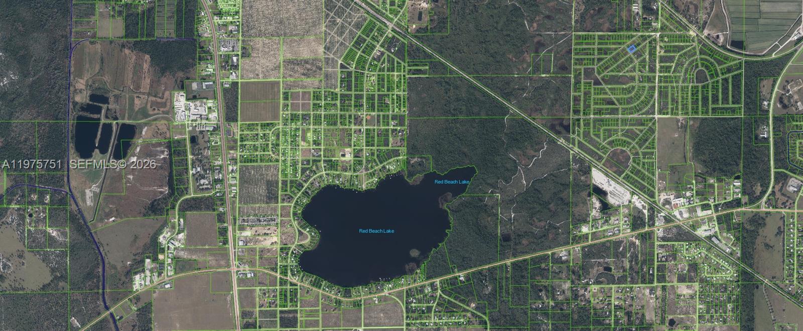This is an aerial map showing land parcels surrounding Red Beach Lake — 449 S Cross Road, Sebring FL 33870, SEBRING, FL