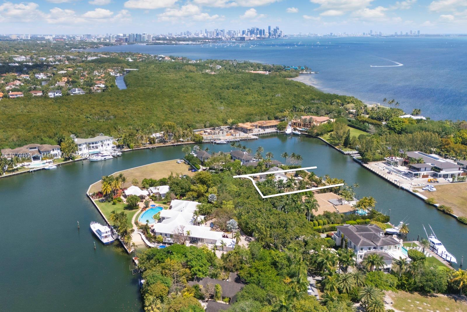 An aerial view shows a waterfront residential property with a white outline highlighting a house — 30 Leucadendra Dr, Coral Gables FL 33156, CORAL GABLES, FL