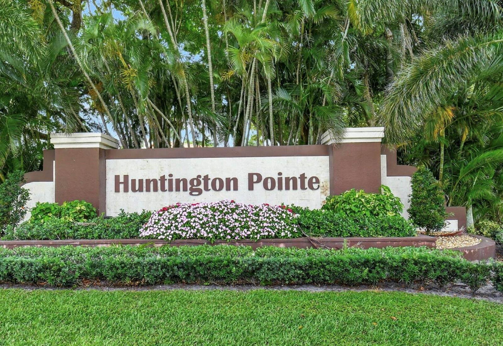 A brown and white monument sign for Huntington Pointe sits in front of palm trees — 6356 Pointe Pleasant Circle, Delray Beach FL 33484, DELRAY BEACH, FL