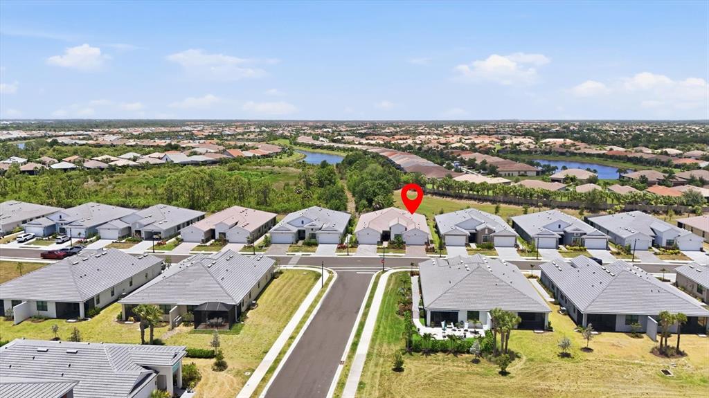 An aerial view shows a suburban neighborhood with single-story houses and a red location pin — 18839 DAYSPRING PLACE, VENICE, FL