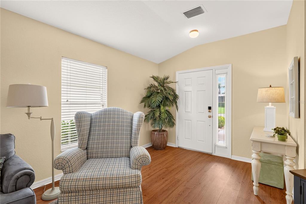 A single-story house with a two-car garage, a palm tree, and a landscaped front yard — 13088 SE 86TH CIRCLE, SUMMERFIELD, FL