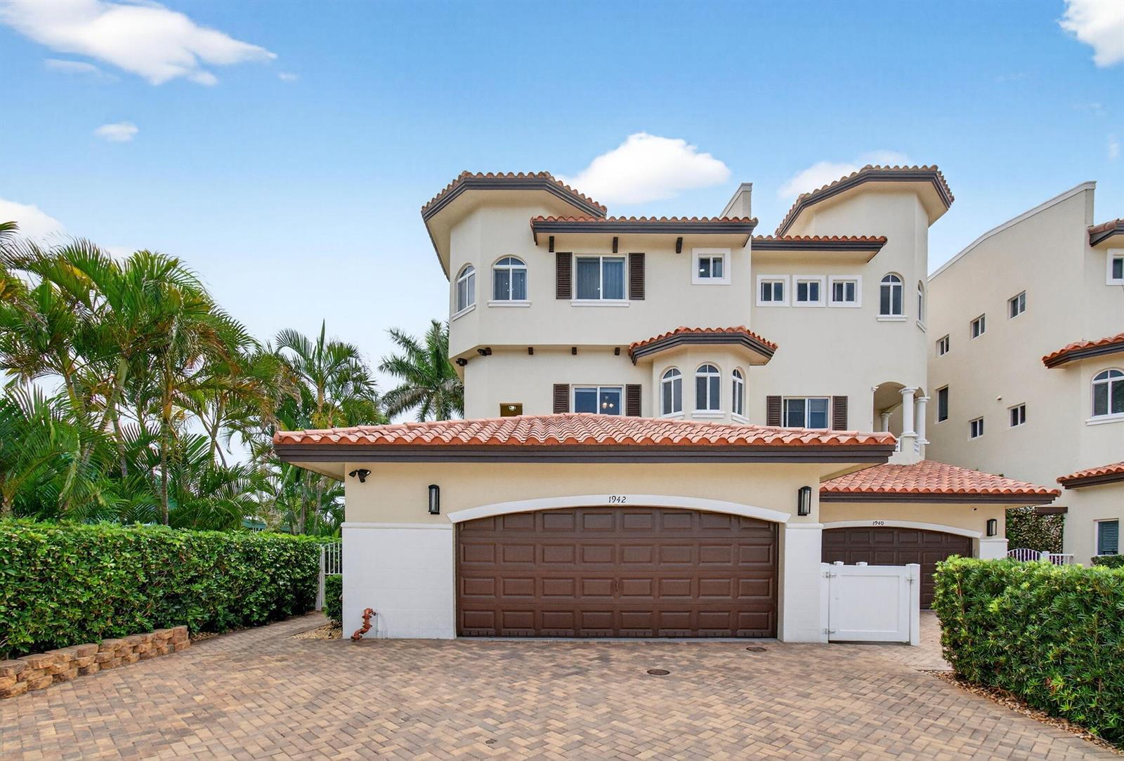 A three-story stucco house with a tiled roof and a two-car garage — 1942 NE 6th Street # C, Deerfield Beach FL 33441, DEERFIELD BEACH, FL