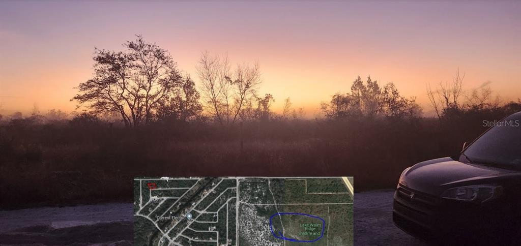 A sunset view over a field with a small inset map of the surrounding area — 4606 PIEDMONT AVENUE, SEBRING, FL