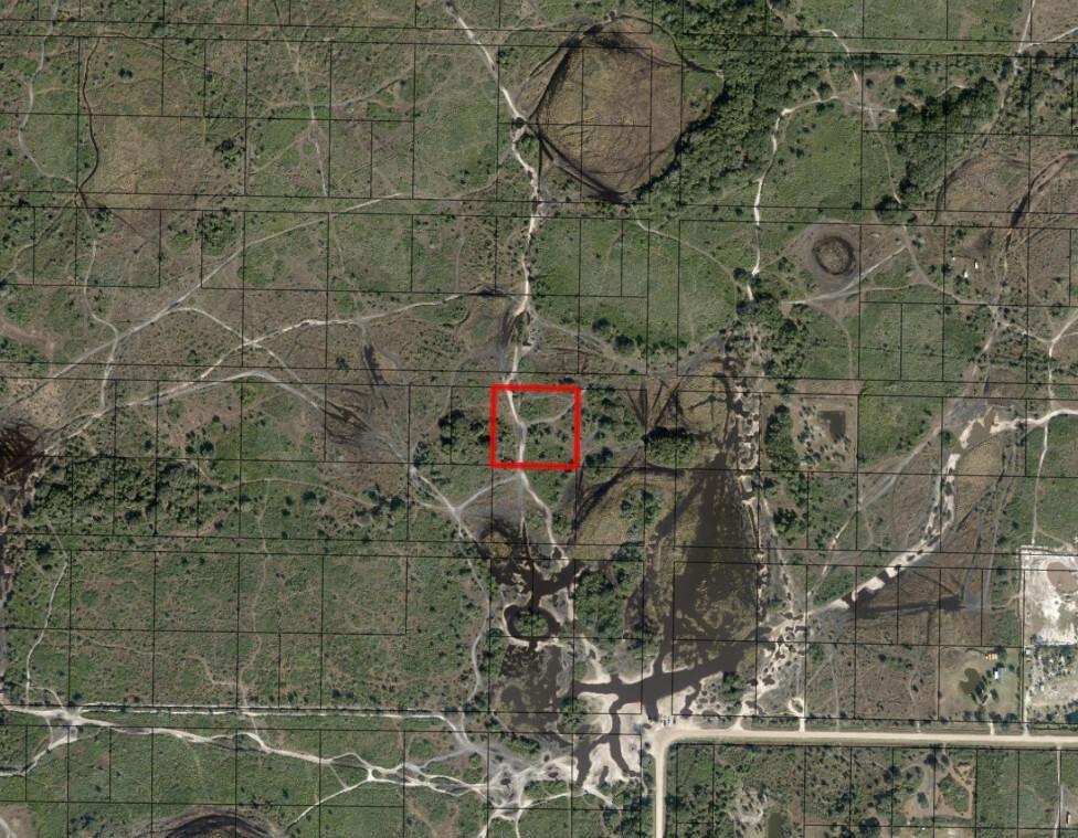 This is an aerial map showing a rectangular plot of land highlighted in red — 0 NW 308th Street, Okeechobee FL 34972, OKEECHOBEE, FL