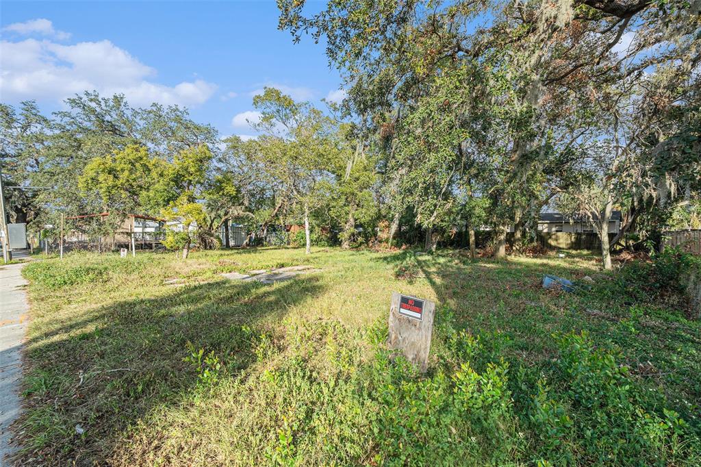 A vacant, grassy lot with mature trees and a no trespassing sign — 4505 N 34TH STREET, TAMPA, FL