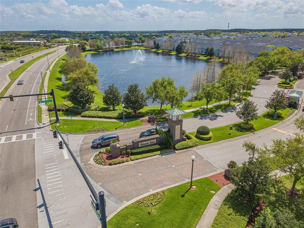 An aerial view of the Spring Isle community entrance featuring a lake with a fountain — 1615 CROYDON STREET, ORLANDO, FL