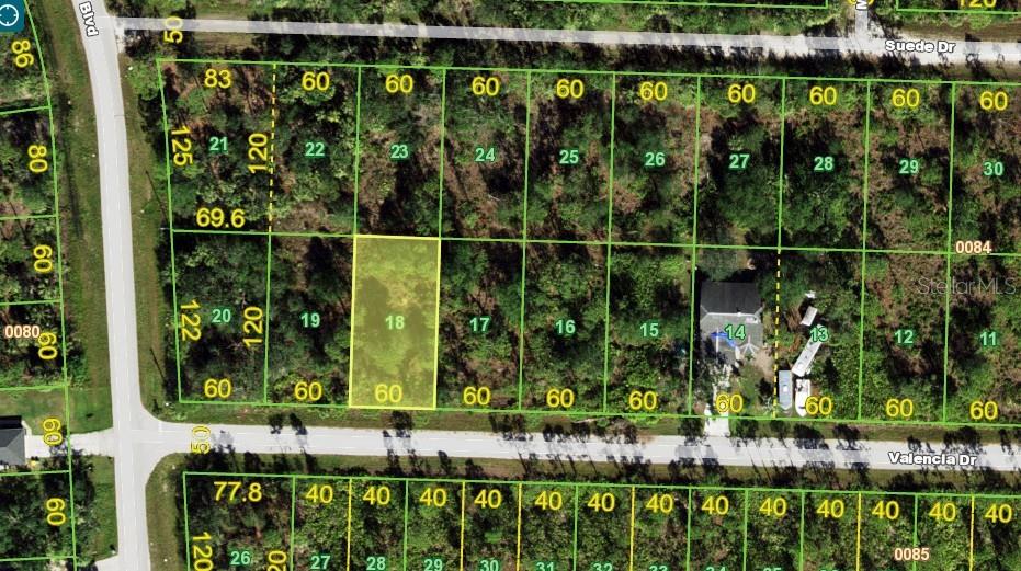 This is a map showing a highlighted vacant residential lot among other subdivided land parcels — 27064 VALENCIA DRIVE, PUNTA GORDA, FL
