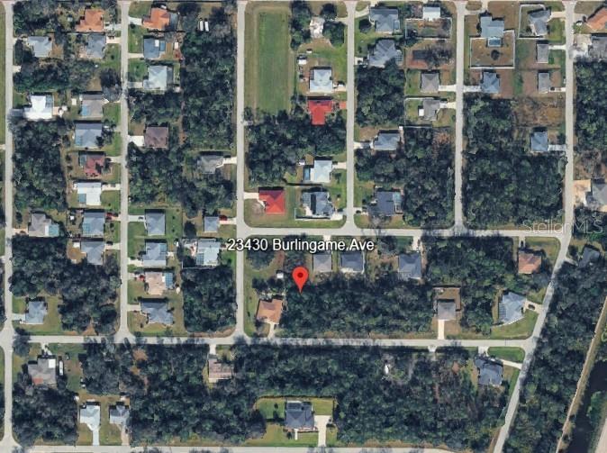 This is an aerial map view of a residential lot in a wooded neighborhood — 23430 BURLINGAME AVENUE, PUNTA GORDA, FL