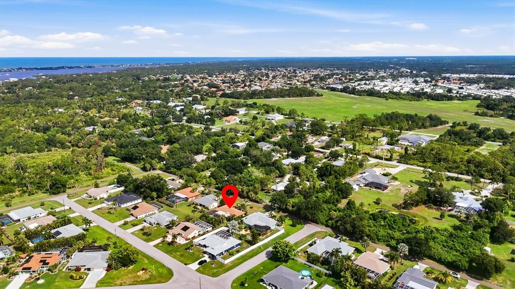 An aerial view shows a residential neighborhood with a red pin marking a specific house — 925 N BOUNDARY ROAD, ENGLEWOOD, FL
