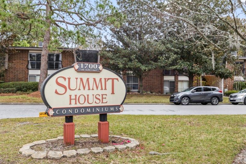 A sign for Summit House Condominiums stands in front of a brick apartment building — 1700 SW 16TH COURT UNIT C5, GAINESVILLE, FL