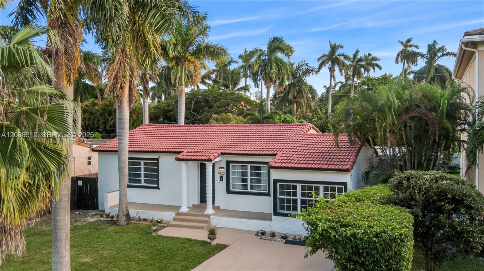 A single-story house with a red tile roof, white stucco walls, and palm trees — 1422 Wiley St, Hollywood FL 33020, HOLLYWOOD, FL