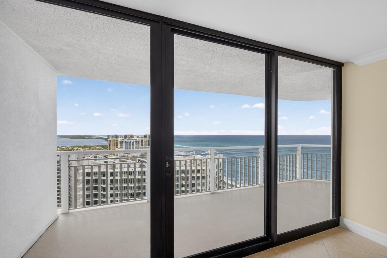 A room with large sliding glass doors opening to a balcony overlooking the ocean — 3000 N Ocean Drive # B, Singer Island FL 33404, SINGER ISLAND, FL