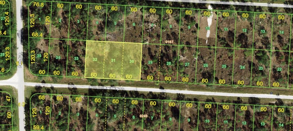This is a map showing three highlighted adjacent land parcels numbered 30, 31, and 32 — 27300 MANDALAY DRIVE, PUNTA GORDA, FL