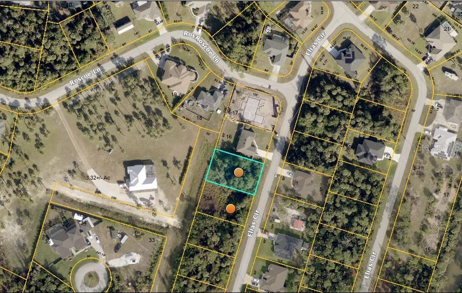 This is an aerial map showing residential lots and streets in a wooded neighborhood — ELIAS CIRCLE, NORTH PORT, FL