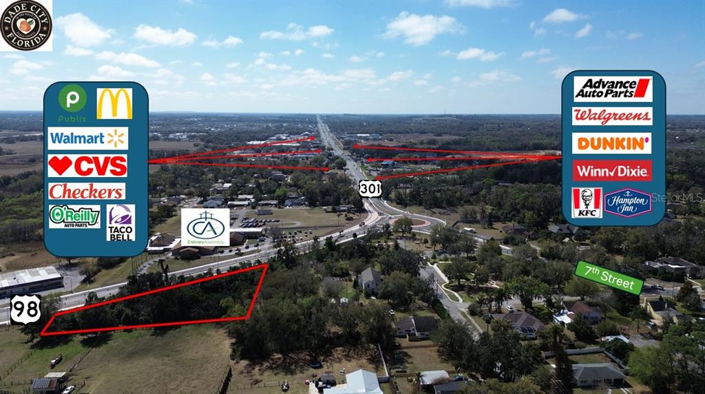 This aerial map shows a vacant lot outlined in red near a highway intersection — US HWY 98 BYPASS, DADE CITY, FL