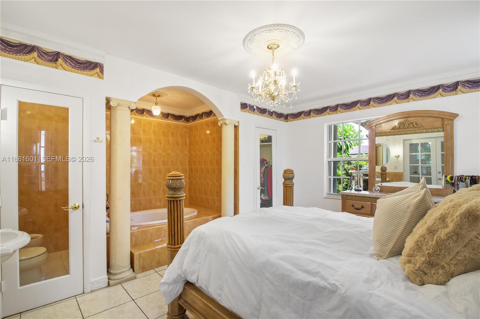 A house exterior features a red paved driveway, a covered porch, and a Buddha fountain — 6101 SW 13th Ter, West Miami FL 33144, WEST MIAMI, FL