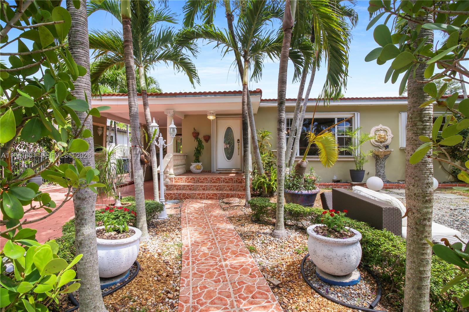 A single-story house with a red paved driveway, a carport, and several palm trees — 6101 SW 13th Ter, West Miami FL 33144, WEST MIAMI, FL