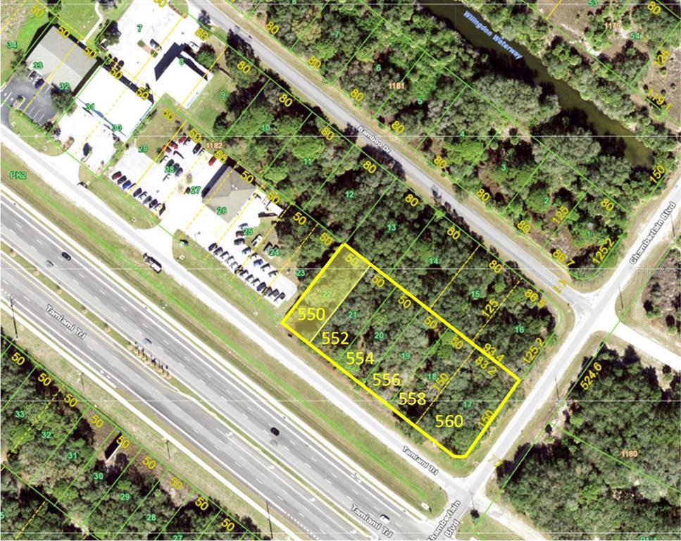 This is an aerial map showing a highlighted parcel of land along a highway — 550 TAMIAMI TRAIL, PORT CHARLOTTE, FL