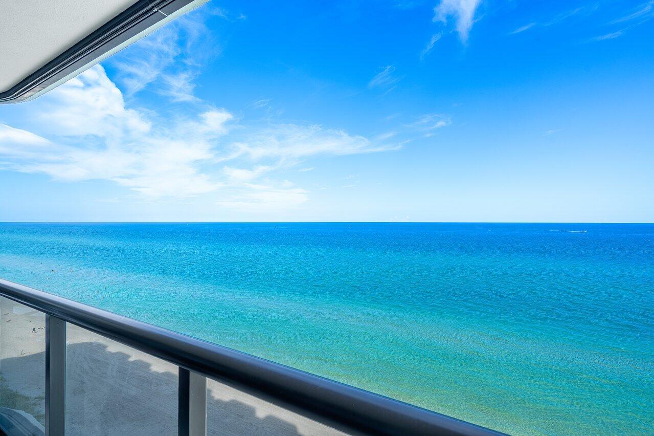 A balcony view overlooking the blue ocean under a clear sky — 250 S Ocean Boulevard, Boca Raton FL 33432, BOCA RATON, FL