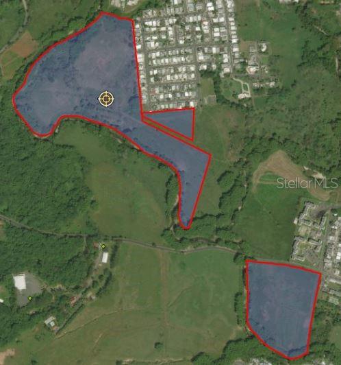 An aerial map shows two distinct land parcels outlined in red over a grassy landscape — RIO CULEBRINAS, SAN SEBASTIAN, PR